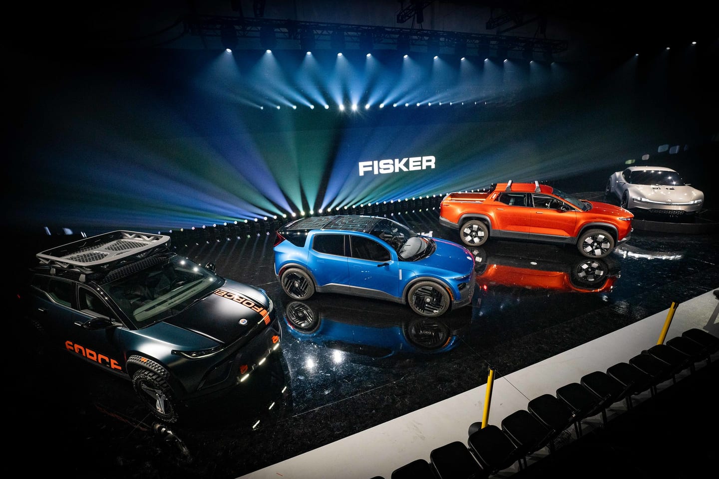 Full Fisker electric vehicle lineup revealed under stage lighting at a Fisker product show