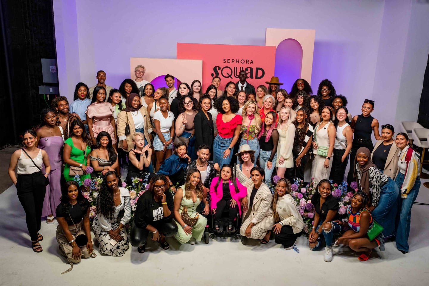 Group photo of the Sephora Squad creator community at a Sephora brand event
