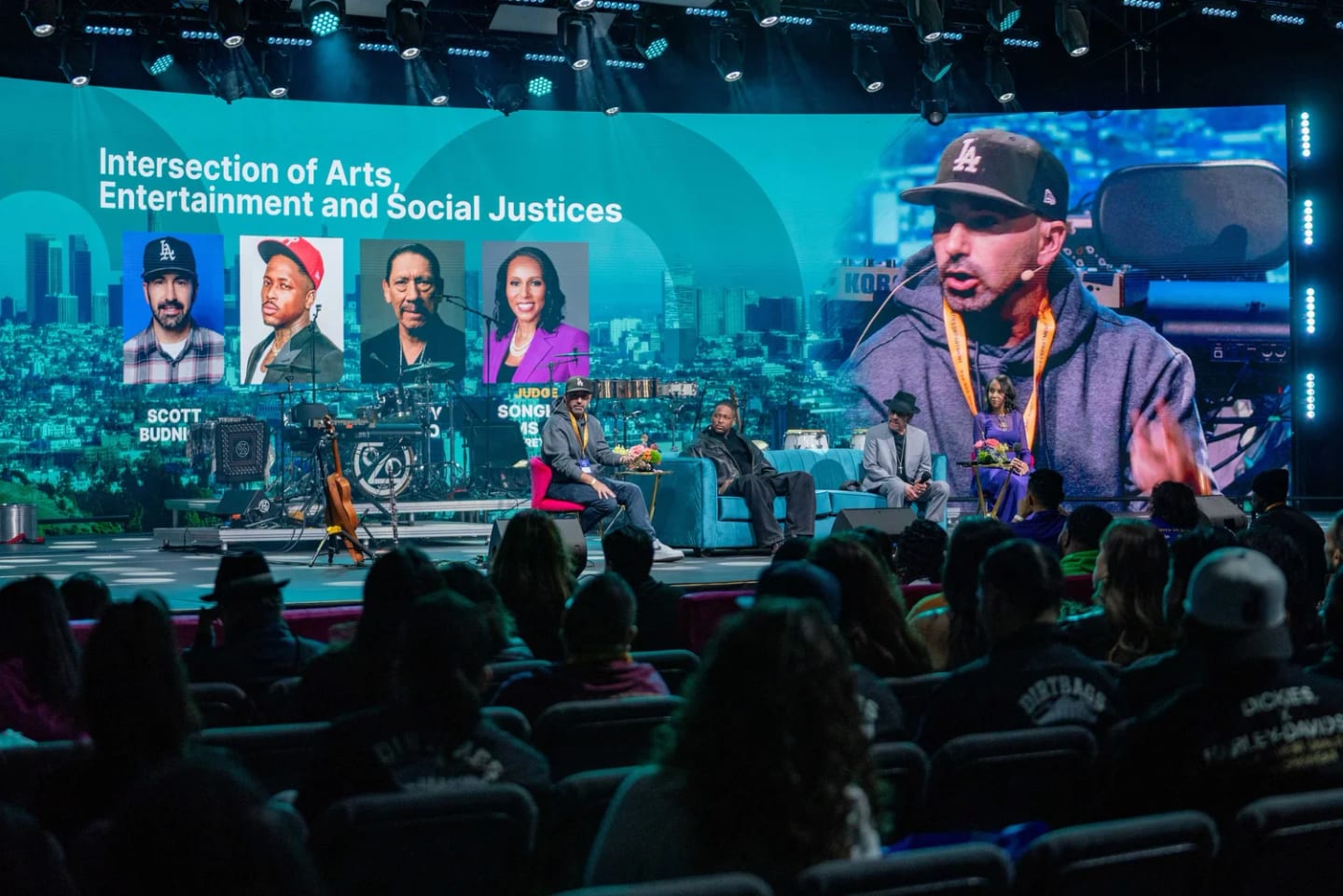 Scott Budnick, Danny Trejo and fellow panelists on stage for the Intersection of Arts, Entertainment and Social Justice panel at the JCOD Summit in Inglewood