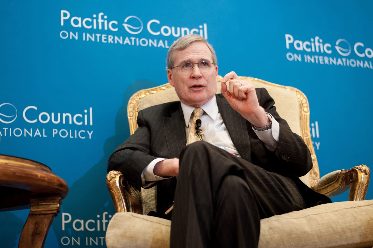 Speaker in an armchair fireside chat at the Pacific Council on International Policy