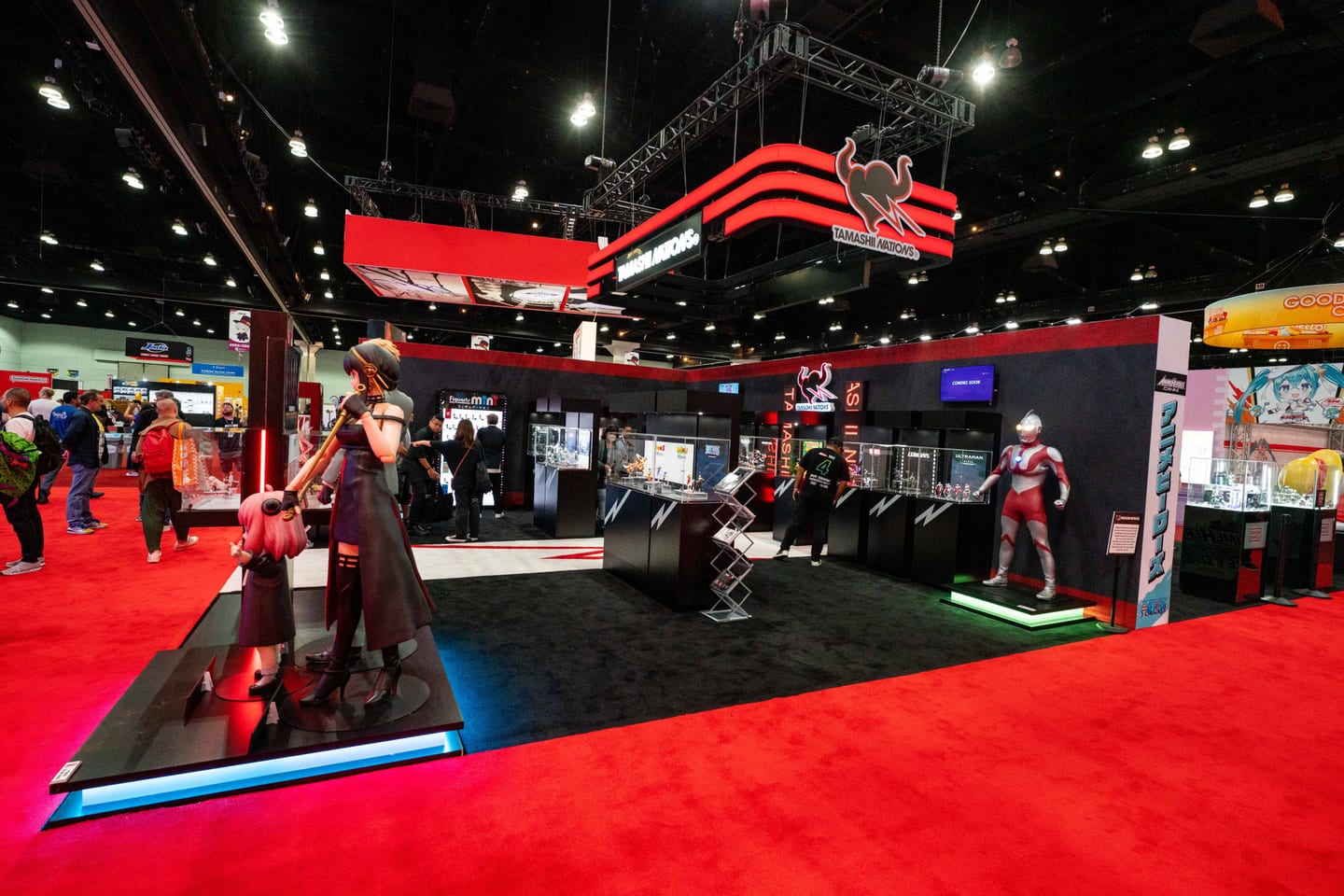 The Tamashii Nations exhibit with Ultraman and anime figures on the Anime Expo convention floor at the Los Angeles Convention Center